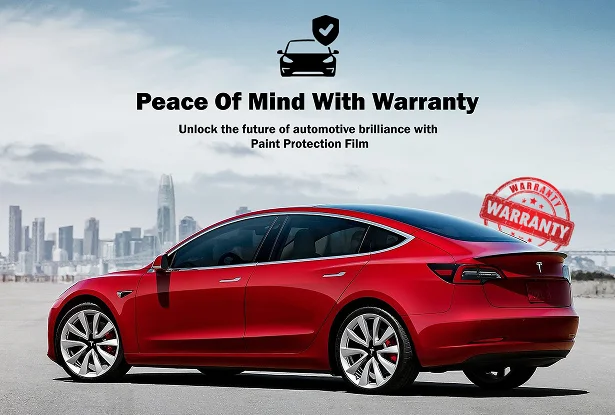 Red Tesla Model 3 parked with city skyline in background promoting paint protection film warranty