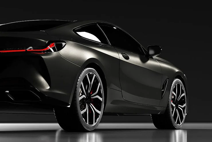 Sleek black sports car with a high-gloss finish, showcasing the benefits of paint protection