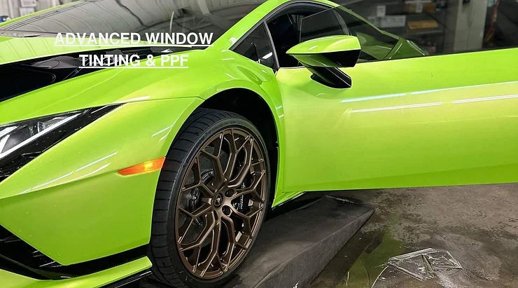 Bright green sports car receiving paint protection treatment at Advanced Window Tinting & PPF
