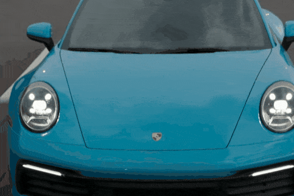 Front view of a bright blue Porsche with dark tinted windows, illustrating how car window tinting helps reduce heat buildup from strong sunlight, especially in Tacoma's variable climate.