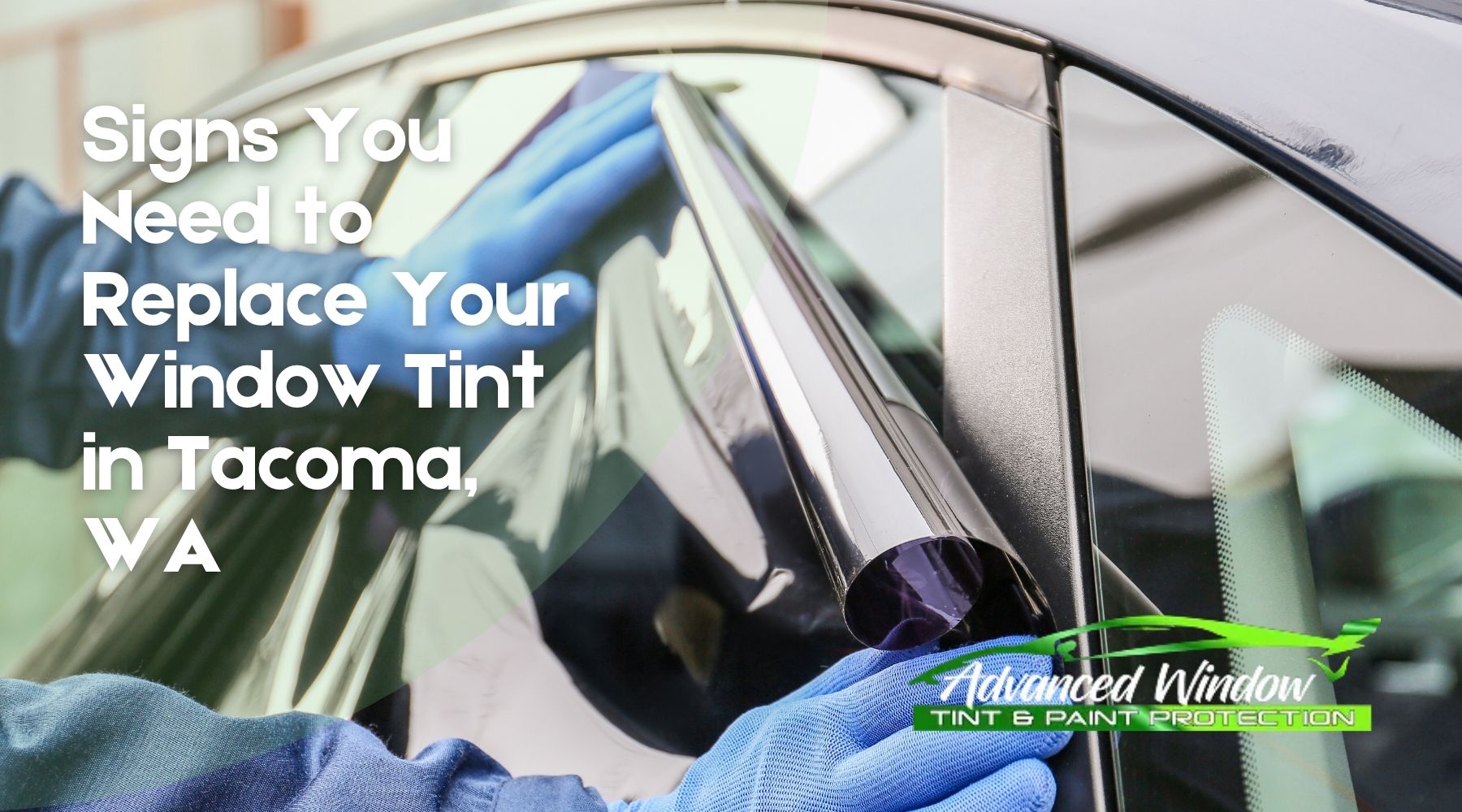 Technician applying window tint film to a car door with text reading Signs You Need to Replace Your Window Tint in Tacoma WA